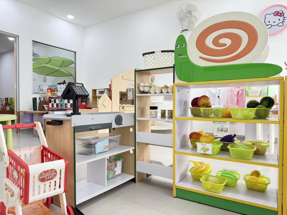 Deli counter with labelled bread, toppings and condiments