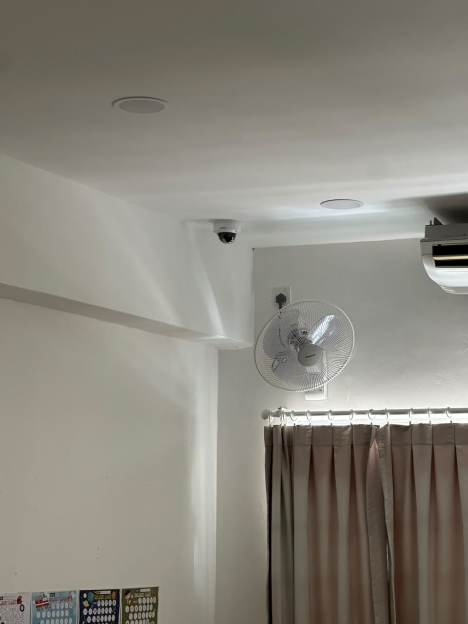 Ceiling-mounted CCTV dome camera covering the classroom area